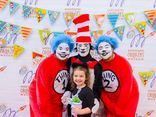 People dressed up as Dr. Seuss Smiling