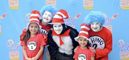 5 People Posing with Dr. Seuss