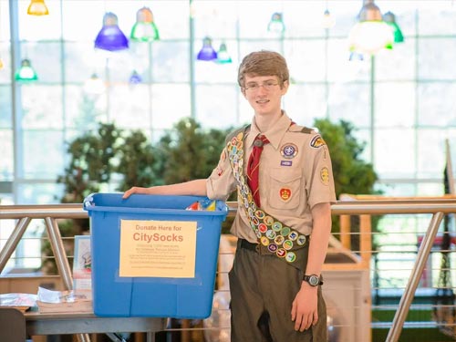 Boy Scout holding box