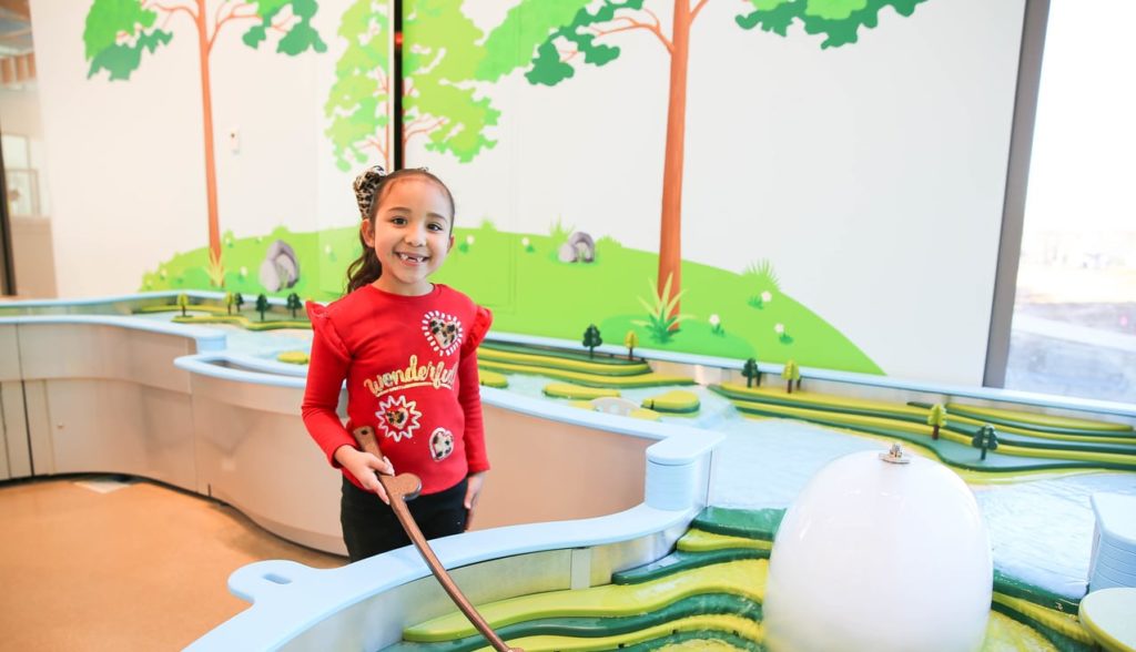 Child playing in the water table at the Mississippi Children's Museum - Meridian