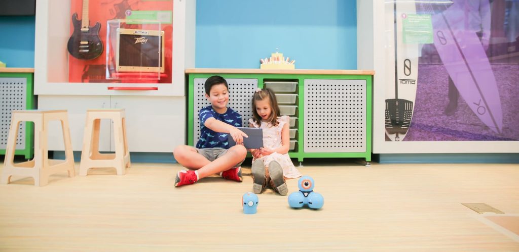 Children playing with dash bots in the WonderBox exhibit at the Mississippi Children's Museum - Meridian