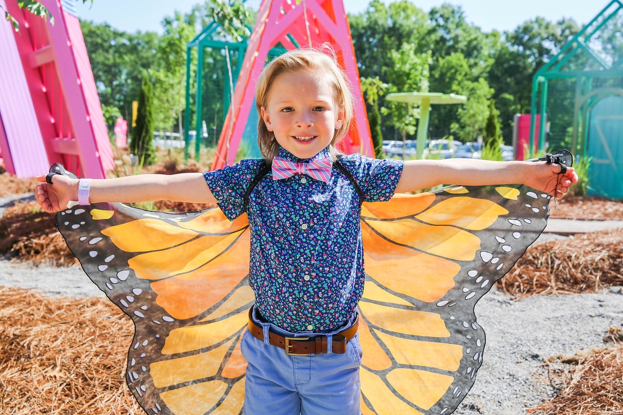 Child wearing butterfly wings