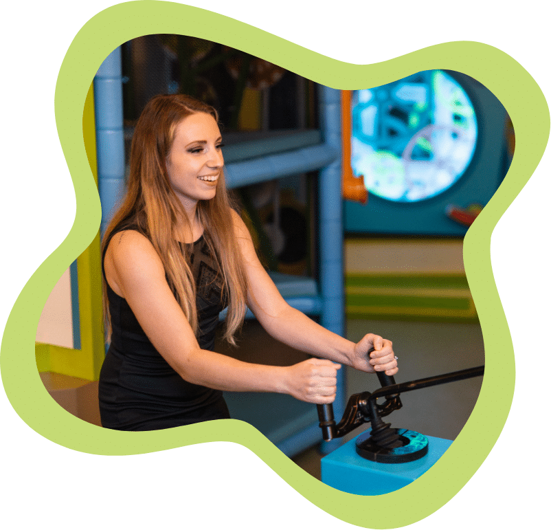 Woman playing with museum exhibit